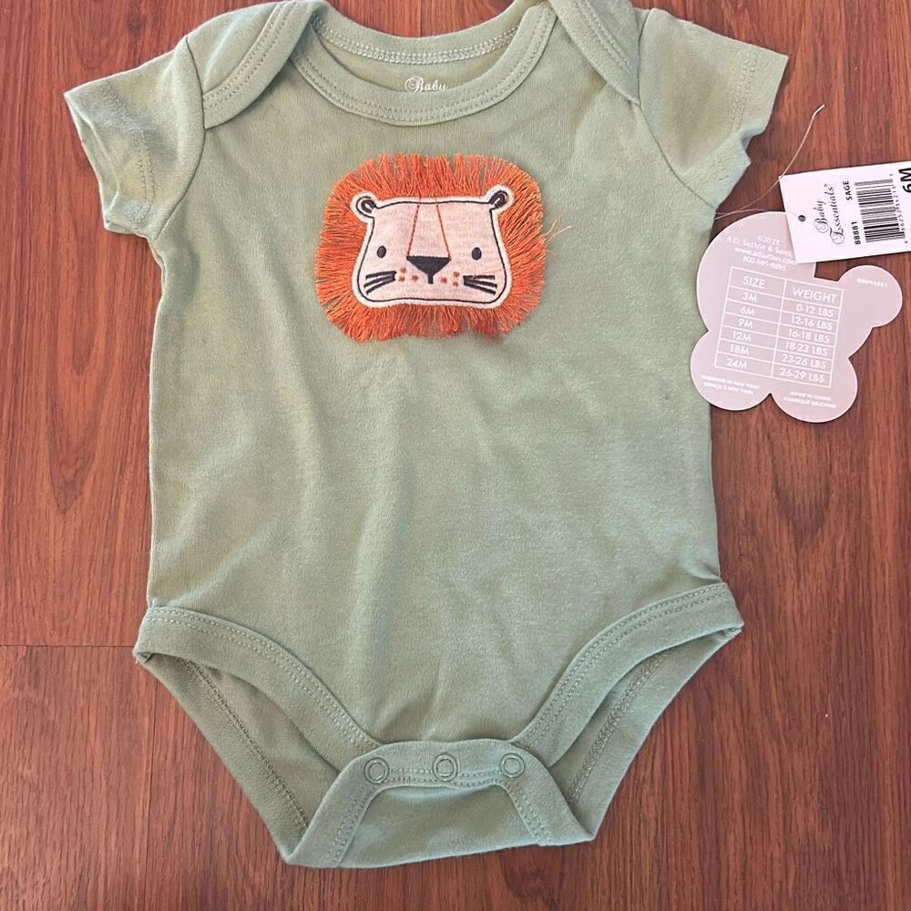 NWT baby essentials one piece lion green six months